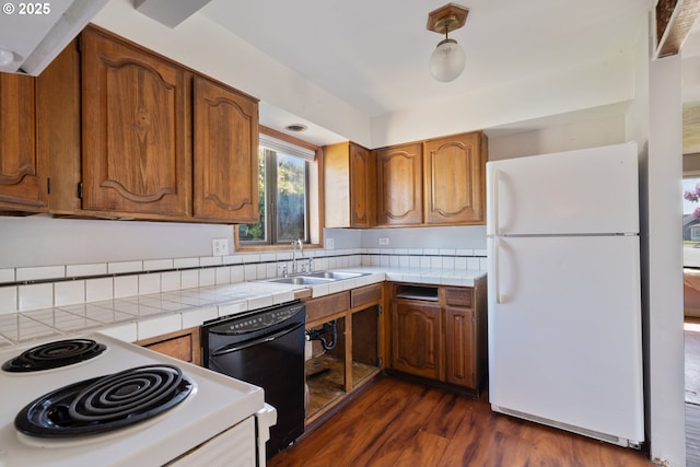 520 Elm Ave, Tillamook, OR 97141 - kitchen with white appliances, a sink, tile counters, and brown cabinets