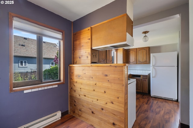 520 Elm Ave, Tillamook, OR 97141 - kitchen featuring freestanding refrigerator, a baseboard heating unit, dark wood-style floors, light countertops, and brown cabinetry