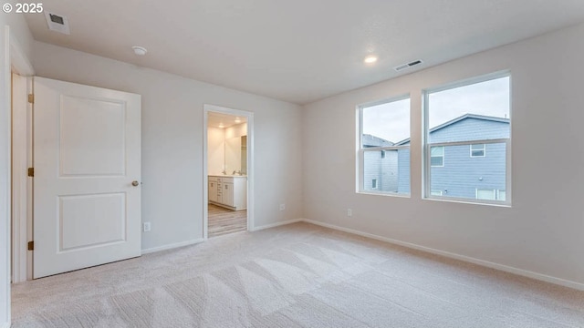 247 Stella St, Salem, OR 97301 - unfurnished bedroom with light carpet, ensuite bath, and recessed lighting