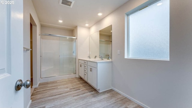 247 Stella St, Salem, OR 97301 - full bathroom featuring a shower stall, vanity, wood finished floors, and recessed lighting