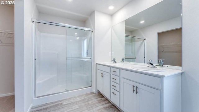 247 Stella St, Salem, OR 97301 - full bath with a spacious closet, double vanity, a shower stall, and recessed lighting