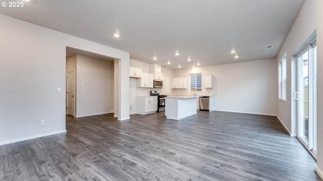 247 Stella St, Salem, OR 97301 - unfurnished living room with dark wood-style floors and recessed lighting