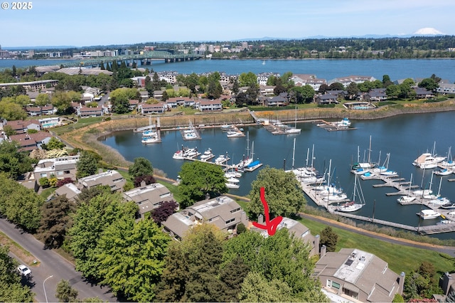 drone / aerial view of a large body of water and a marina