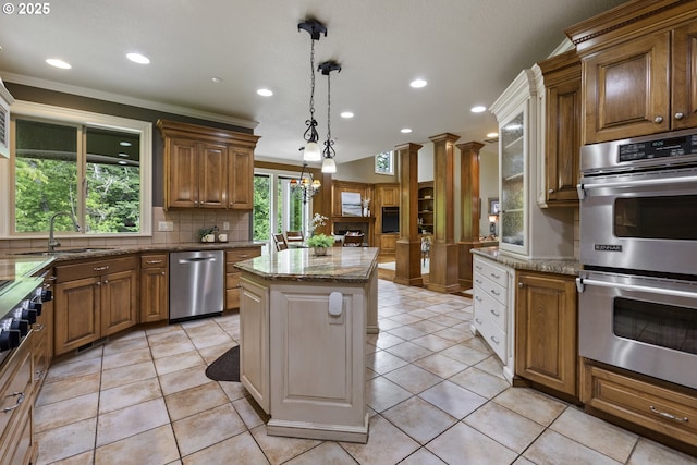 24800 SW Big Fir Rd, West Linn, OR 97068 - kitchen featuring appliances with stainless steel finishes, a sink, tasteful backsplash, a center island, and recessed lighting
