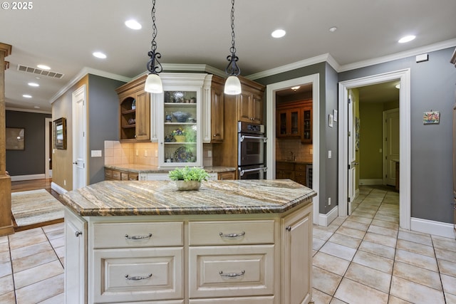 24800 SW Big Fir Rd, West Linn, OR 97068 - kitchen featuring stainless steel double oven, decorative backsplash, recessed lighting, a kitchen island, and baseboards