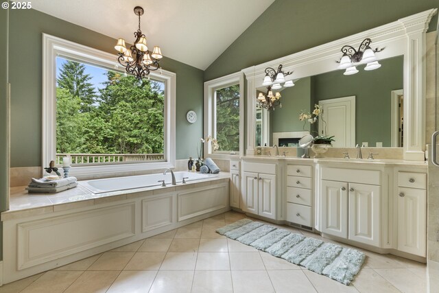 24800 SW Big Fir Rd, West Linn, OR 97068 - bathroom featuring a chandelier, lofted ceiling, double vanity, a garden tub, and tile patterned flooring