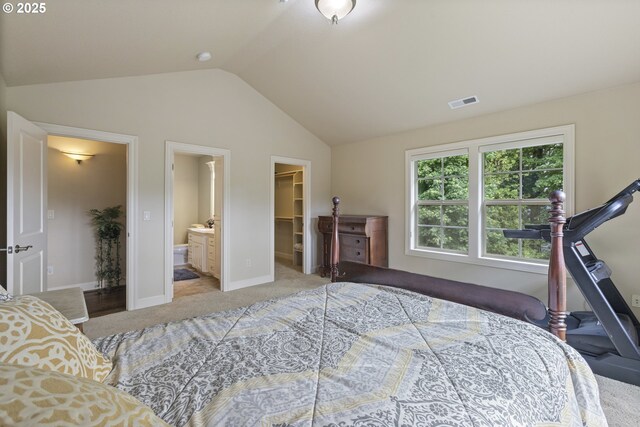 24800 SW Big Fir Rd, West Linn, OR 97068 - bedroom featuring a spacious closet, vaulted ceiling, carpet, connected bathroom, and baseboards