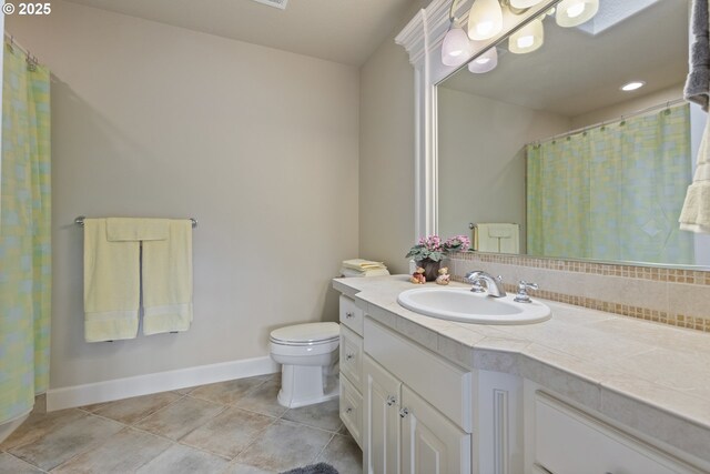 24800 SW Big Fir Rd, West Linn, OR 97068 - full bathroom with vanity, toilet, baseboards, and tile patterned floors