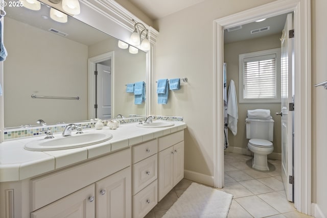 24800 SW Big Fir Rd, West Linn, OR 97068 - full bath featuring double vanity, tile patterned floors, toilet, and baseboards