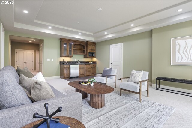 24800 SW Big Fir Rd, West Linn, OR 97068 - living area with wet bar, light carpet, recessed lighting, a tray ceiling, and baseboards
