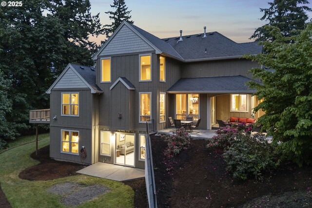 24800 SW Big Fir Rd, West Linn, OR 97068 - back of property with a patio area, a shingled roof, outdoor lounge area, and a wooden deck