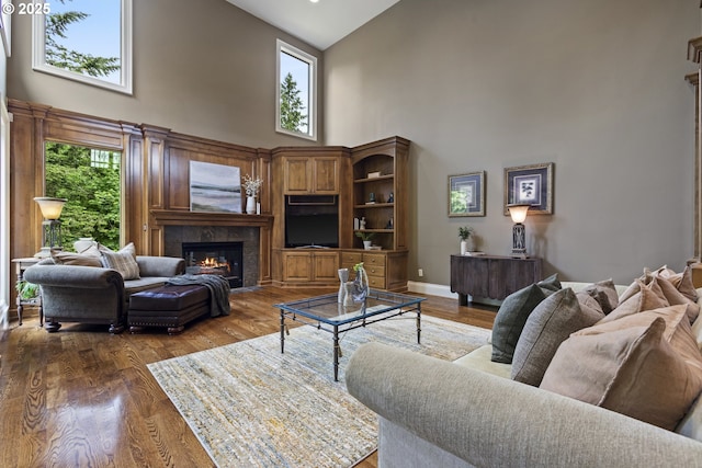 24800 SW Big Fir Rd, West Linn, OR 97068 - living room with high vaulted ceiling, a fireplace, and wood finished floors