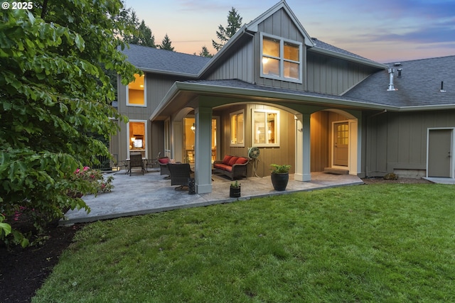 24800 SW Big Fir Rd, West Linn, OR 97068 - rear view of house with a shingled roof, a yard, board and batten siding, and a patio area