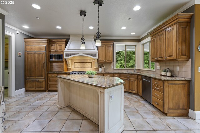 24800 SW Big Fir Rd, West Linn, OR 97068 - kitchen featuring appliances with stainless steel finishes, ornamental molding, a sink, premium range hood, and a center island