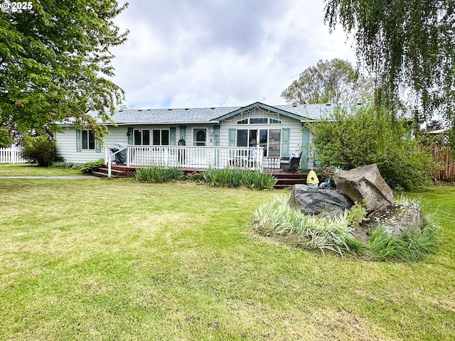 back of house featuring a wooden deck