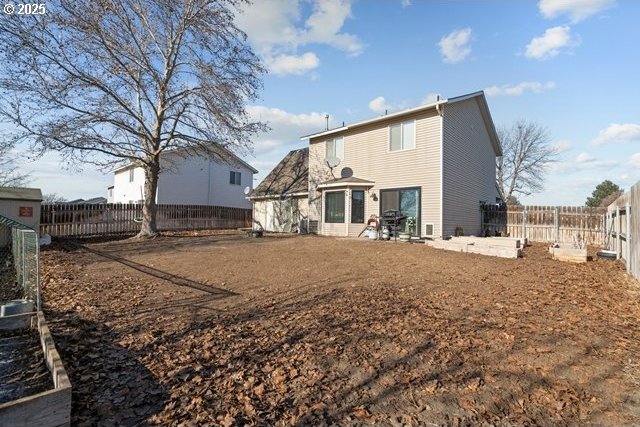 rear view of house featuring a patio area