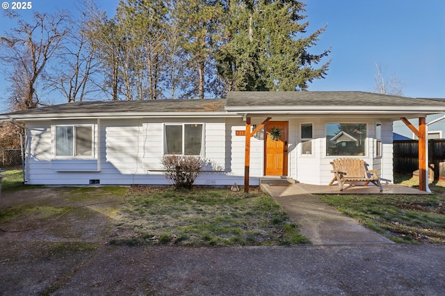 single story home featuring covered porch