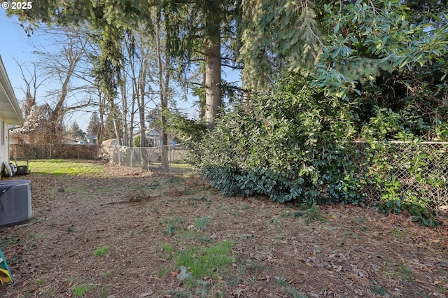 view of yard with central AC unit