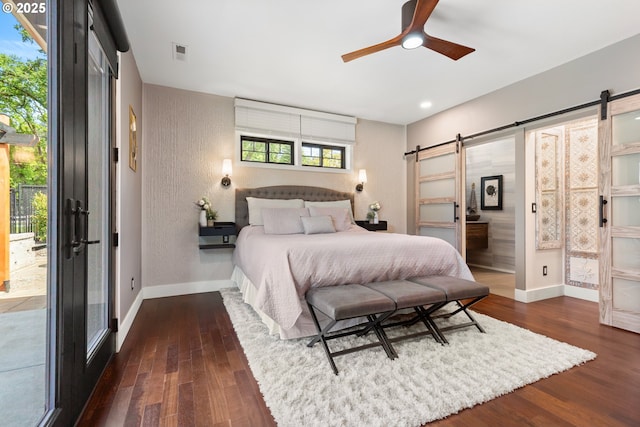 22961 SE Filbert Rd, Eagle Creek, OR 97022 - bedroom featuring a barn door, access to exterior, wood finished floors, baseboards, and recessed lighting