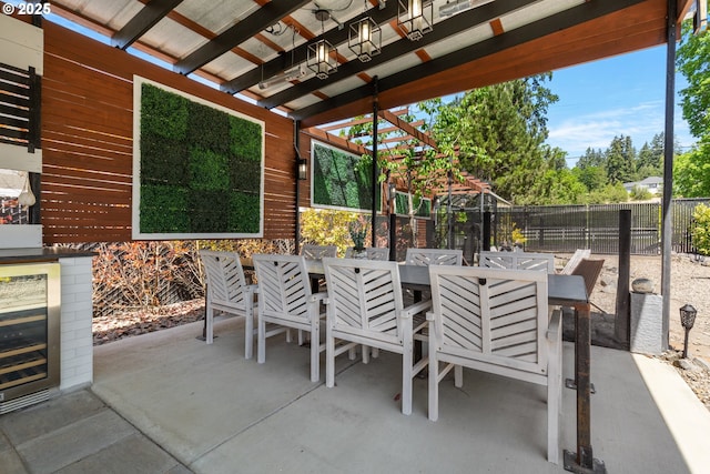 22961 SE Filbert Rd, Eagle Creek, OR 97022 - fenced backyard featuring outdoor dining area, wine cooler, and a patio