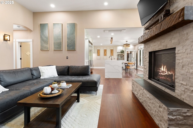 22961 SE Filbert Rd, Eagle Creek, OR 97022 - living area with light wood-type flooring, a lit fireplace, and recessed lighting