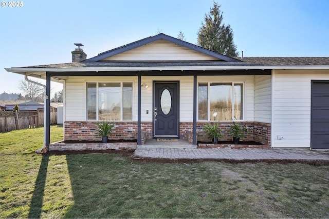 view of front of home with a porch and a front lawn