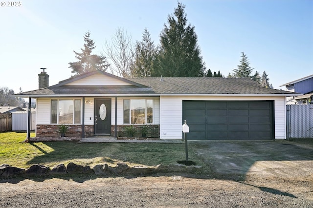 ranch-style home featuring a garage and a front yard