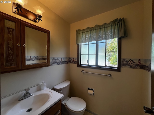 1011 Heather Ct, Reedsport, OR 97467 - bathroom featuring toilet and vanity