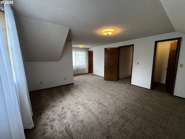 1011 Heather Ct, Reedsport, OR 97467 - additional living space with carpet flooring and a textured ceiling