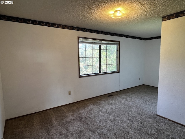 1011 Heather Ct, Reedsport, OR 97467 - empty room featuring carpet floors and a textured ceiling