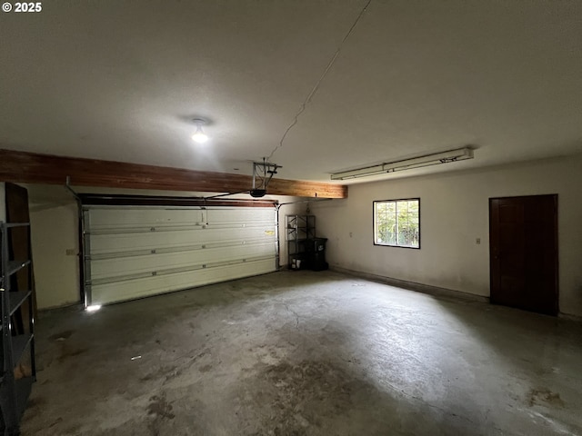 1011 Heather Ct, Reedsport, OR 97467 - garage featuring a garage door opener