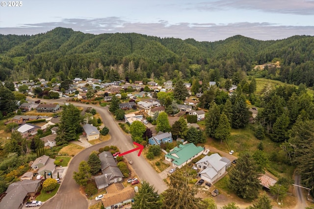 1011 Heather Ct, Reedsport, OR 97467 - view of property location featuring a forest and nearby suburban area