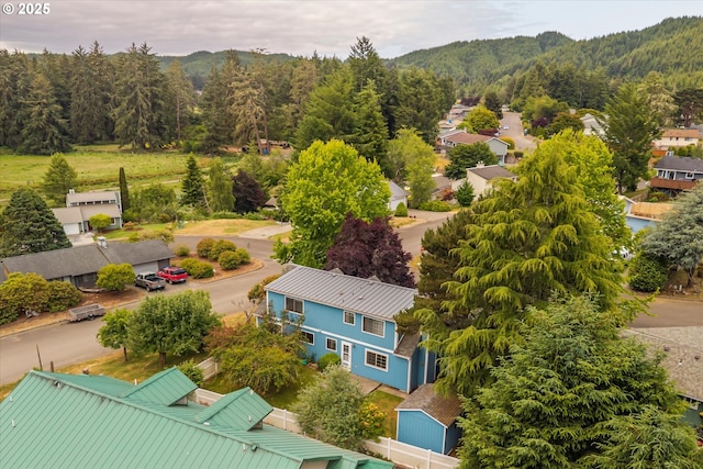 1011 Heather Ct, Reedsport, OR 97467 - aerial perspective of suburban area with a forest