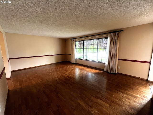 1011 Heather Ct, Reedsport, OR 97467 - spare room with wood finished floors and a textured ceiling