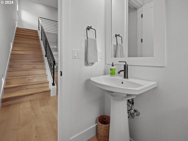 bathroom with hardwood / wood-style floors