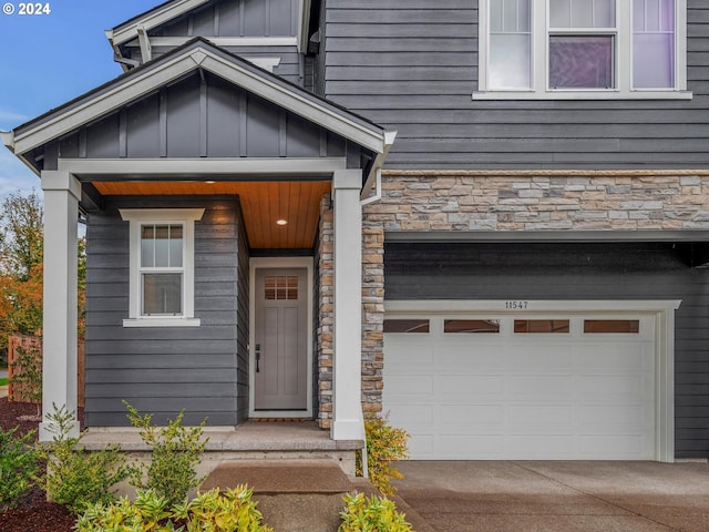 doorway to property with a garage