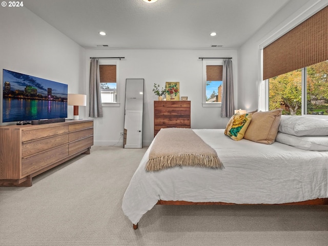 bedroom with light colored carpet