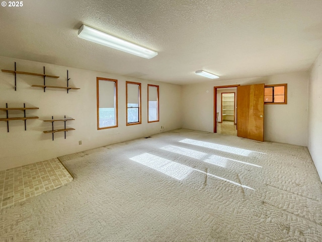 empty room featuring a textured ceiling