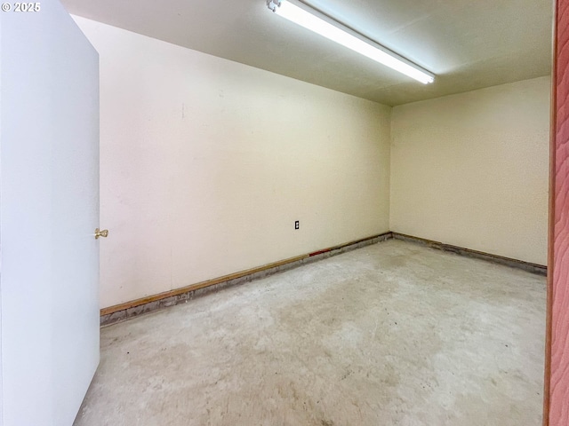 empty room featuring concrete flooring