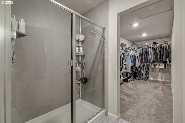 bathroom with a shower with shower door