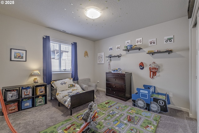 carpeted bedroom with a textured ceiling