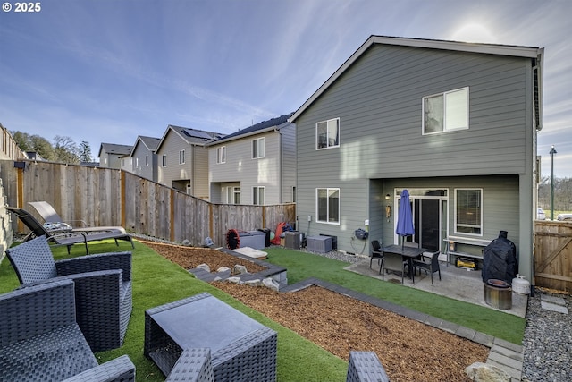 rear view of property with central air condition unit, a patio area, and a yard