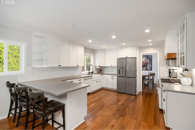 17890 SW 109th Ave, Tualatin, OR 97062 - kitchen with white appliances, a peninsula, open shelves, tasteful backsplash, and recessed lighting