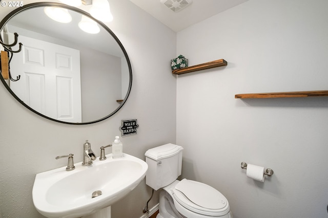 17890 SW 109th Ave, Tualatin, OR 97062 - bathroom featuring a sink, toilet, and baseboards