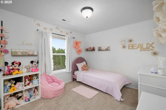 17890 SW 109th Ave, Tualatin, OR 97062 - carpeted bedroom featuring a textured ceiling and baseboards
