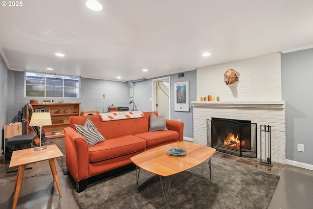 living room with a fireplace, recessed lighting, baseboards, and concrete floors