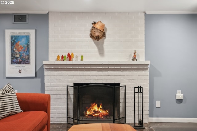 detailed view of a brick fireplace, crown molding, and baseboards