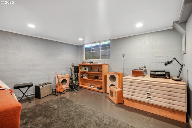 basement with concrete block wall and recessed lighting