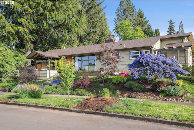 view of front of property featuring a chimney