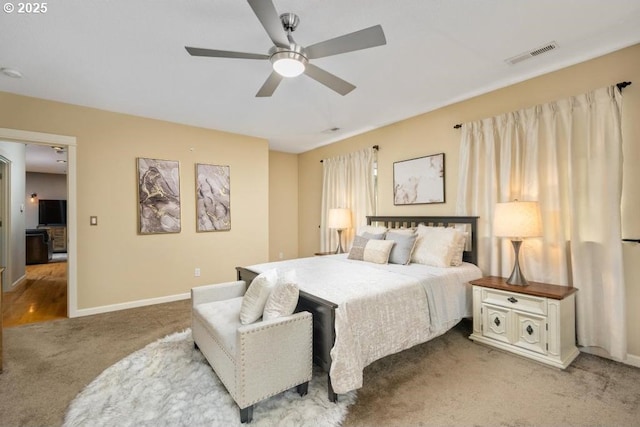 bedroom featuring carpet, baseboards, and a ceiling fan